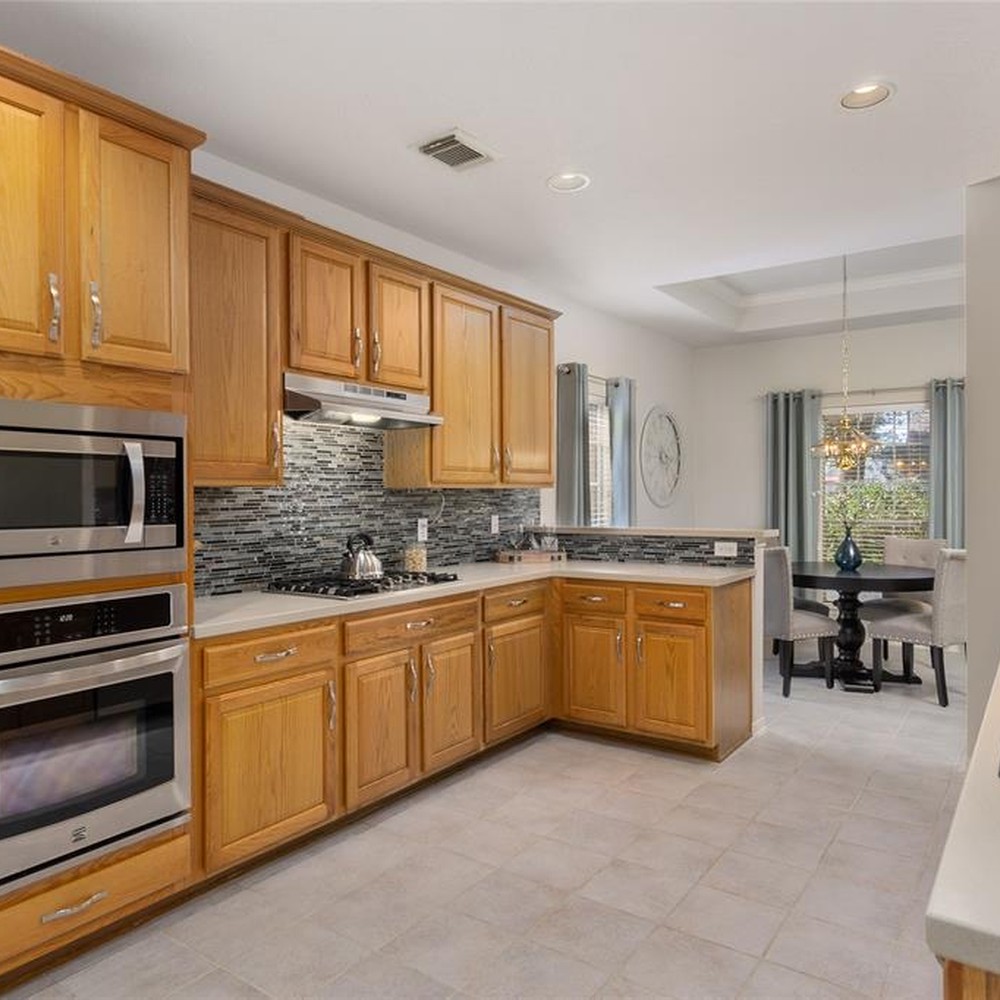 Kitchen with accessories placed on the counter top.