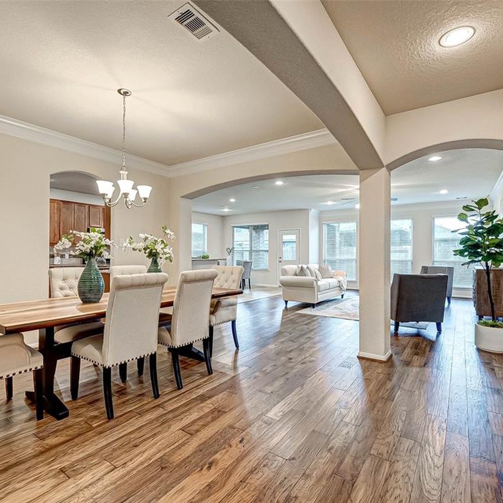 Overview of the entry, dining room, and living room.