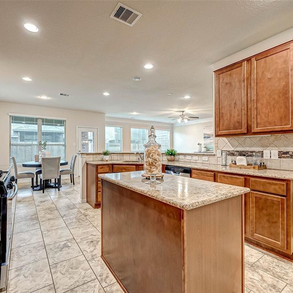 Kitchen with accessories displayed on the counter top.