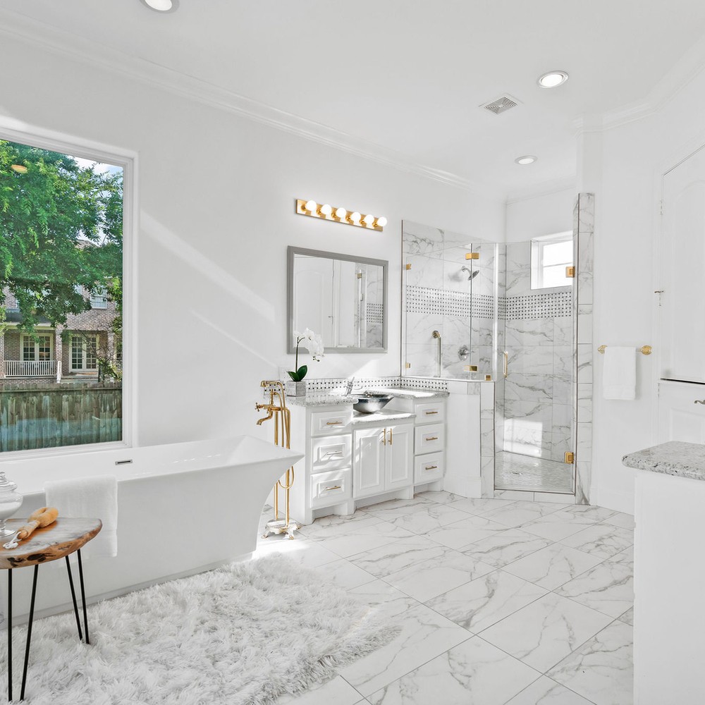 Primary bathroom vanity and shower.
