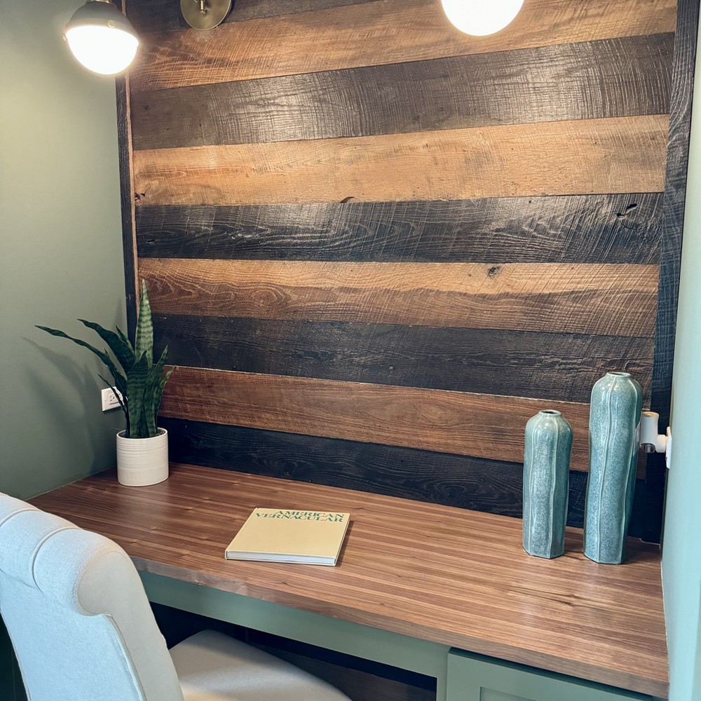 Round Top, TX Home Staging Office with wooden wall accents.
