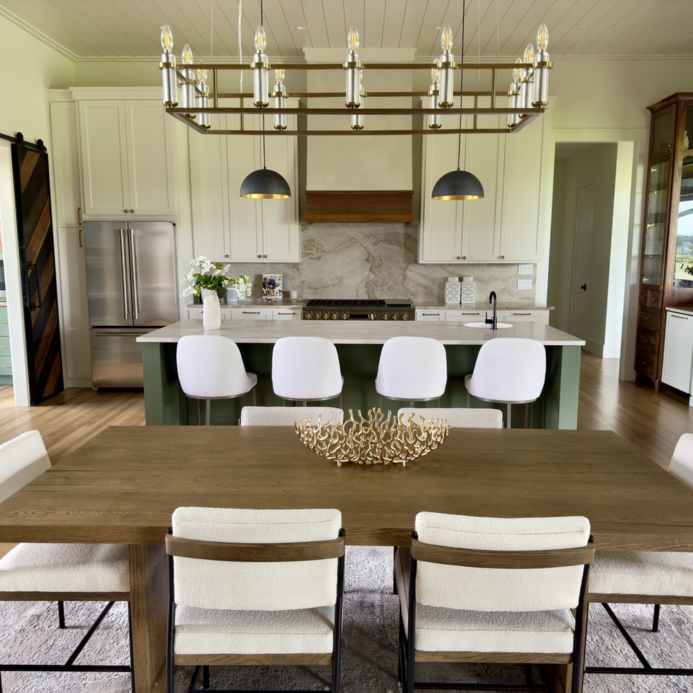 Round Top, TX Kitchen with wooden table, white chairs, marble island, and wooden accents.