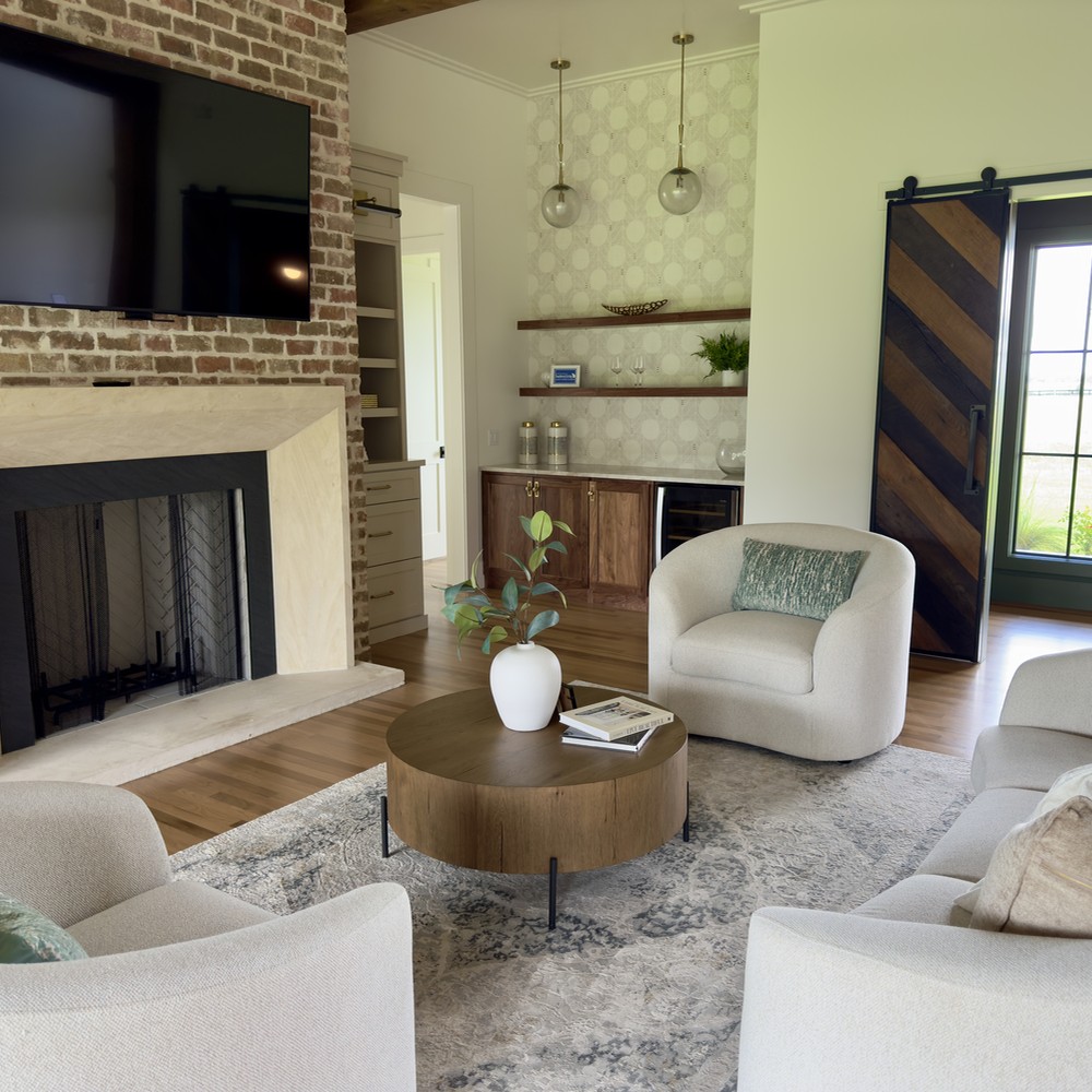 Round Top, TX home staging living room with wooden coffee table and white sofa and chairs.